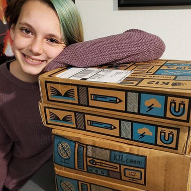 kid with boxes
