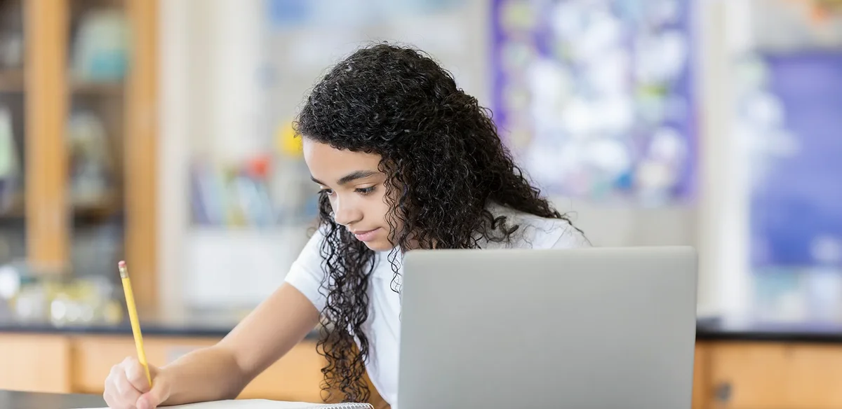 Student taking notes