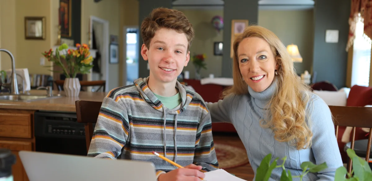 Mother and her son smiling at the camera